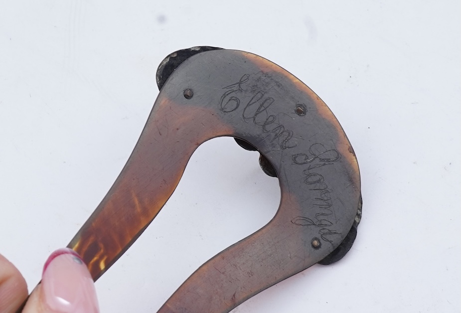 Two paper knives and a hair ornament, early 20th century